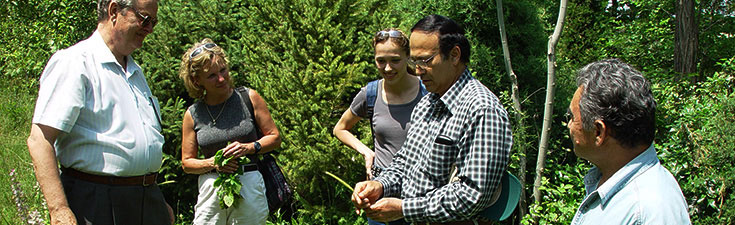 Mary Ann Lila and David Zaurov talking with scientists in Uzbekistan